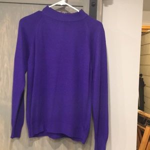 Purple. Zipper in back, sweater